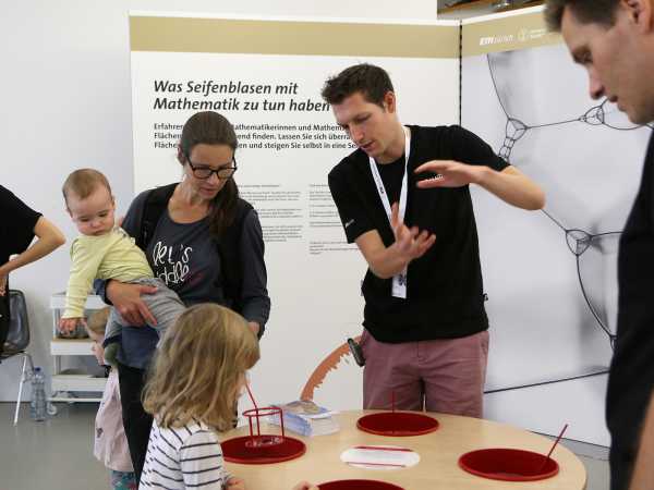 Enlarged view: Visitors at the Scientifica stand of the D-MATH