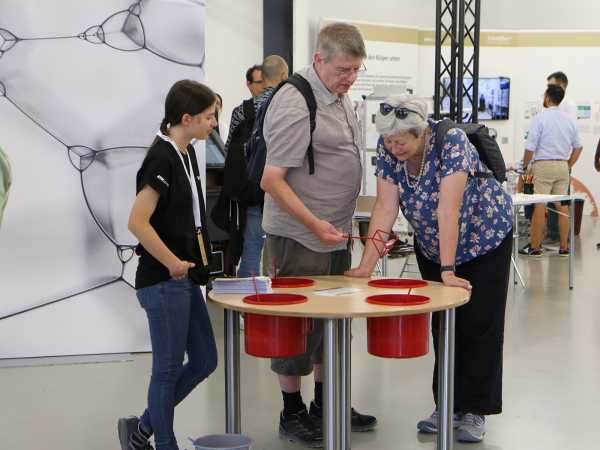 Enlarged view: Visitors at the Scientifica stand of the D-MATH