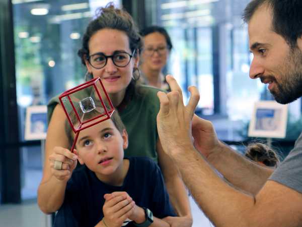 Enlarged view: Visitors at the Scientifica stand of the D-MATH